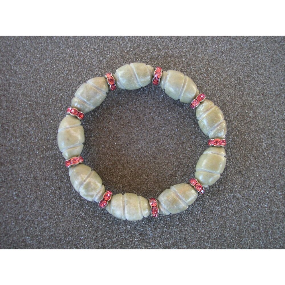 Green Stone Bead Bracelet With Red Crystal Accents On Stretchable Cord